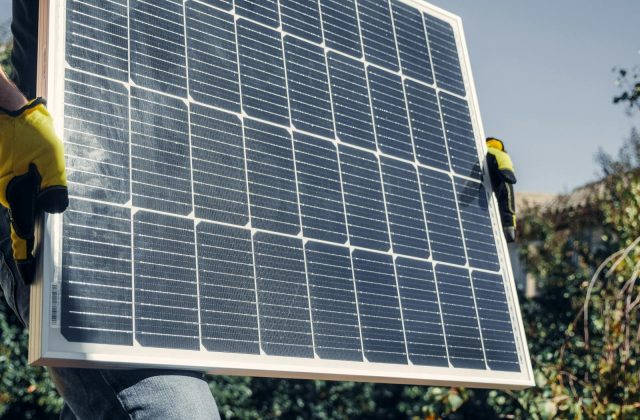 Person reviewing a solar quote and contract