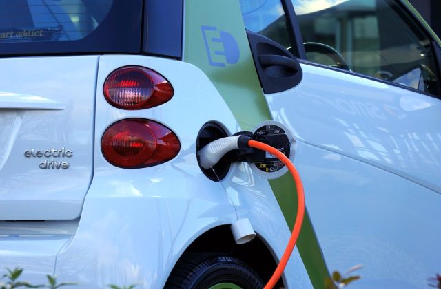 Electric vehicle plugged in for charging