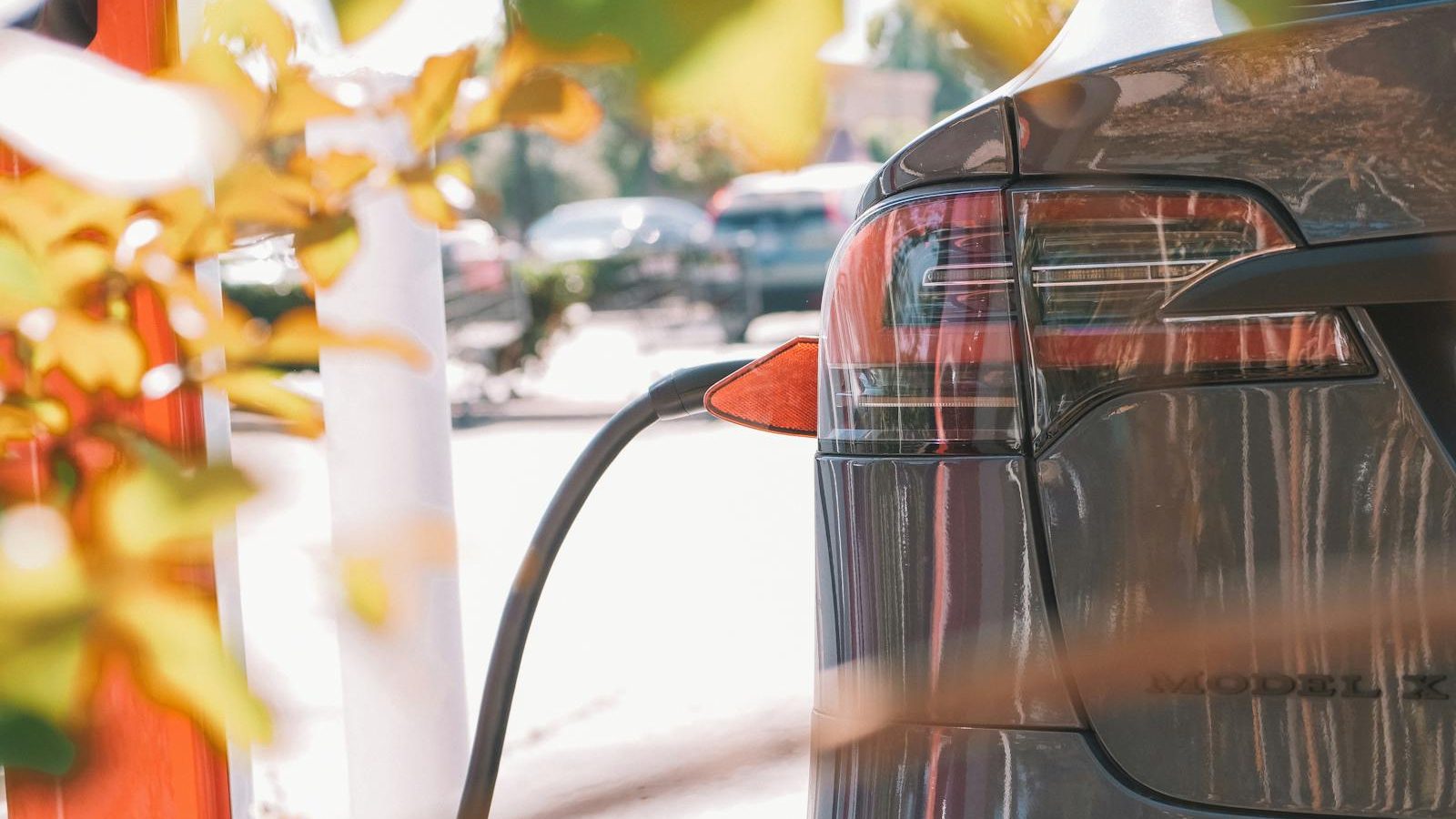 EV parked at a curbside charging station