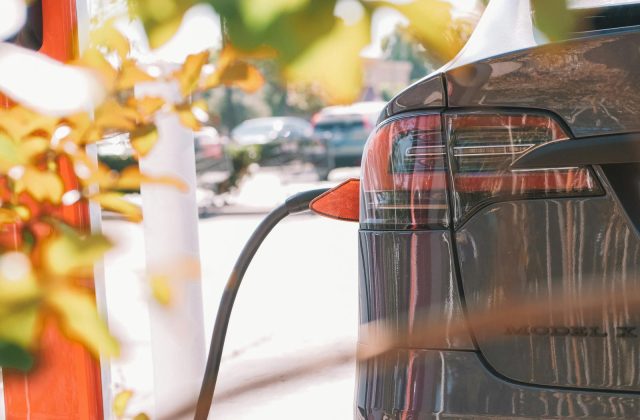 EV parked at a curbside charging station