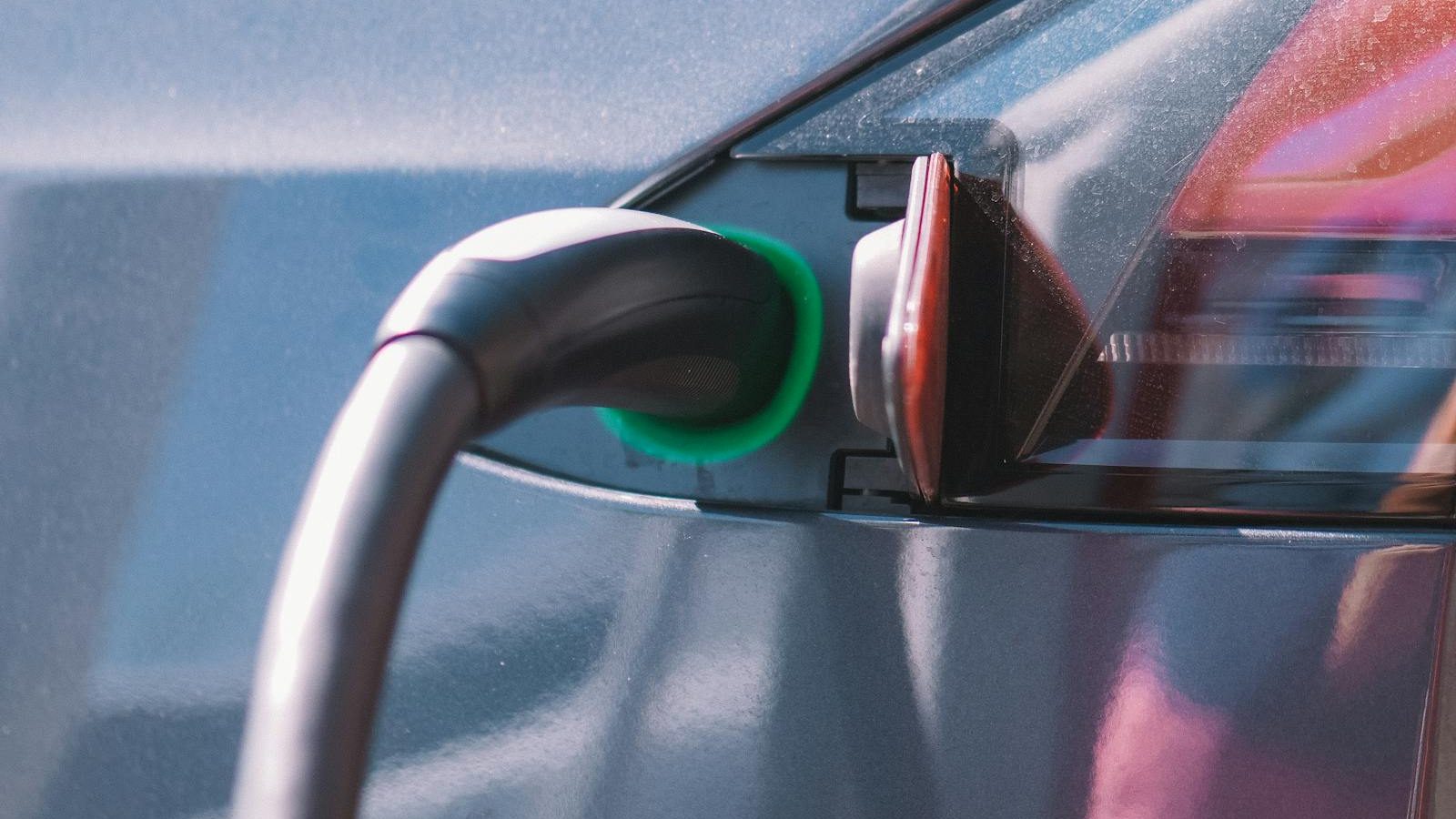 Charging cable coiled near an electric car