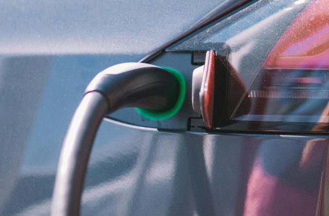 Charging cable coiled near an electric car