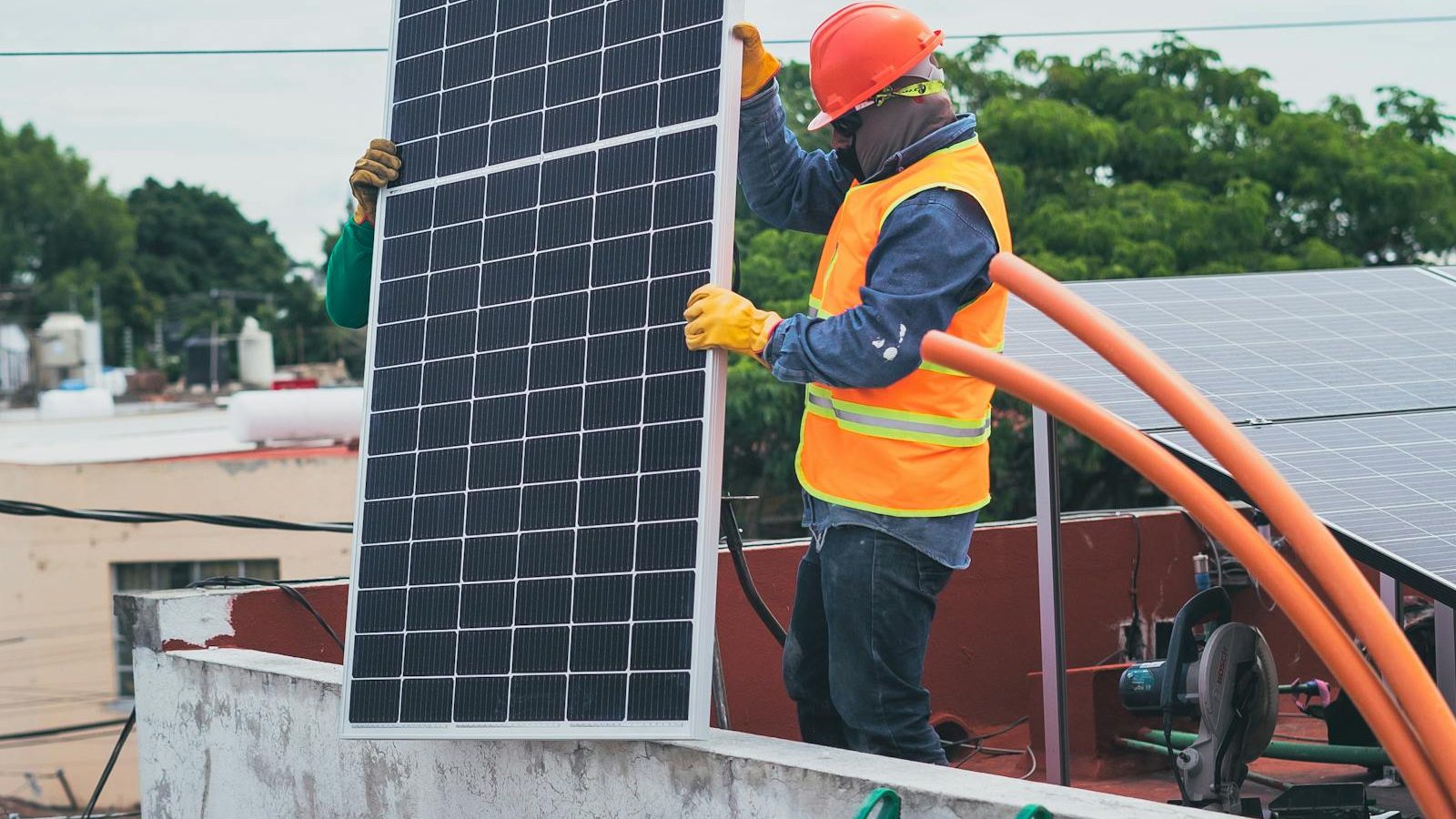 Solar installer reviewing plans with a homeowner