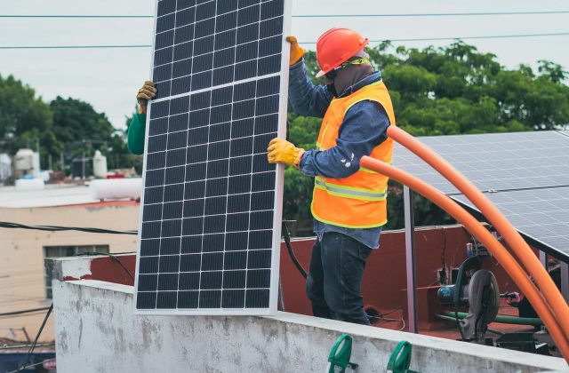 Solar installer reviewing plans with a homeowner