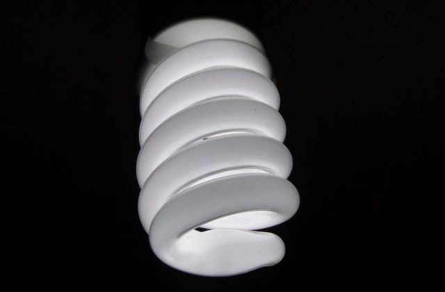 Worker installing home insulation