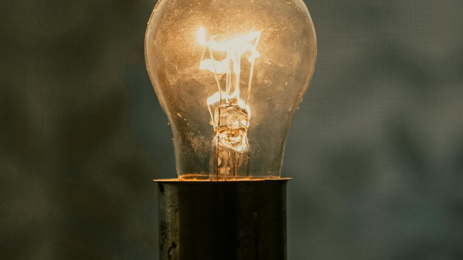 Person inspecting a home thermostat