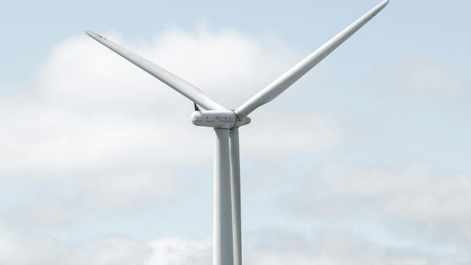 Technician inspecting a wind turbine