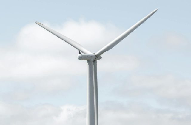 Technician inspecting a wind turbine