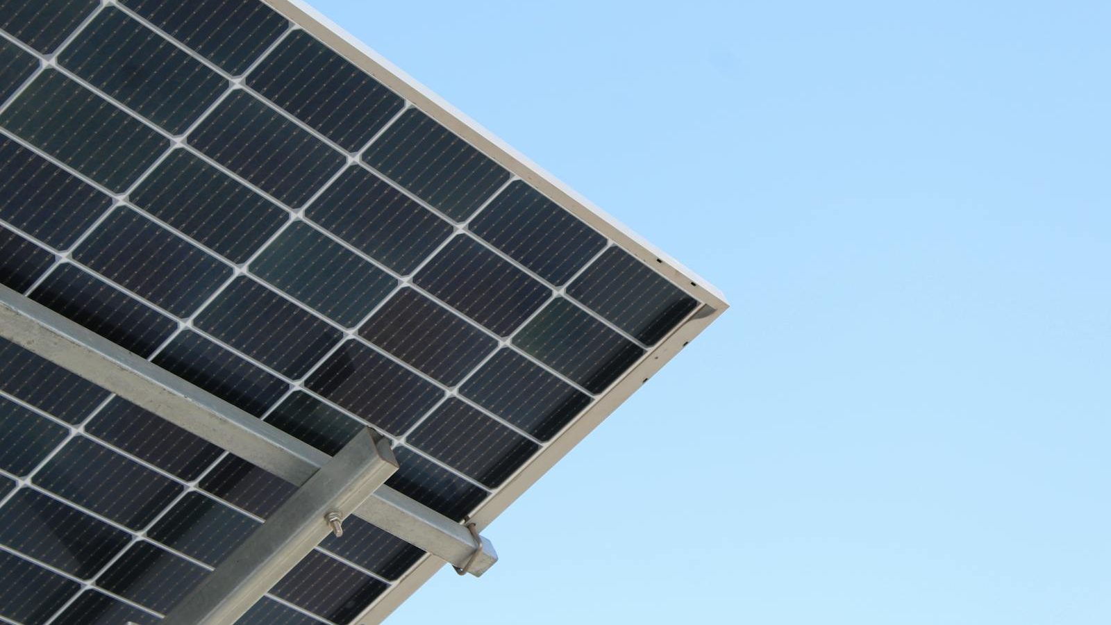 Technician inspecting a solar panel for issues