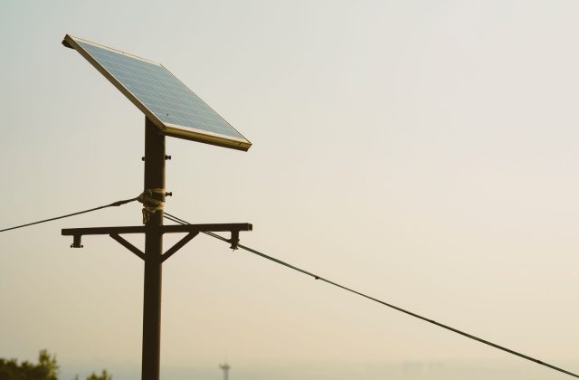 Snow-covered solar panels in winter