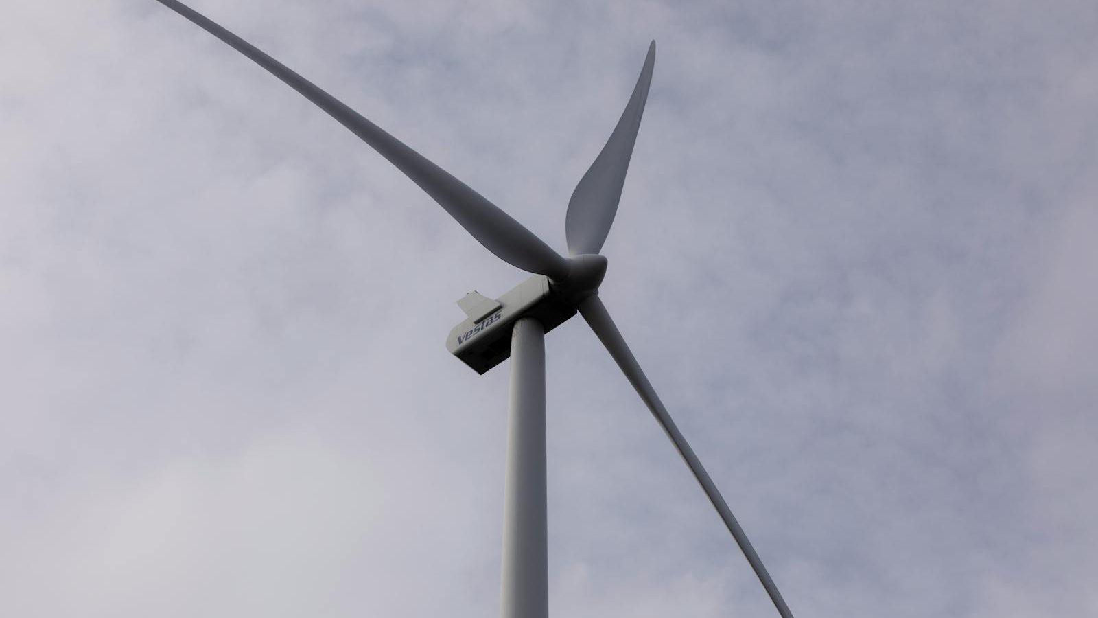 Wind turbine spinning over a field